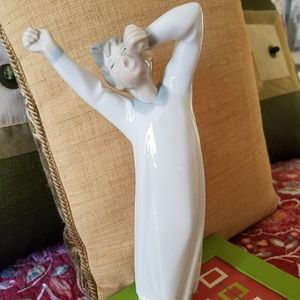 Llardo yawning boy in nightshirt. Retired